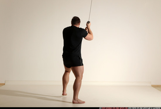 Man Adult Muscular White Fighting with sword Moving poses Sportswear