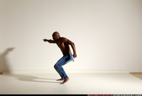 Man Adult Athletic Black Fighting with gun Moving poses Pants