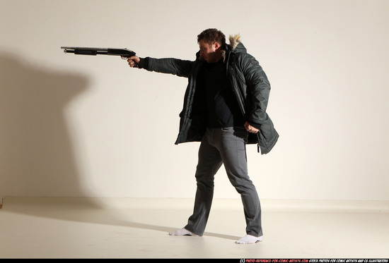 Man Adult Muscular White Fighting with gun Standing poses Casual