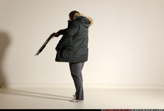 Man Adult Muscular White Fighting with gun Standing poses Casual