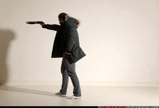 Man Adult Muscular White Fighting with gun Standing poses Casual