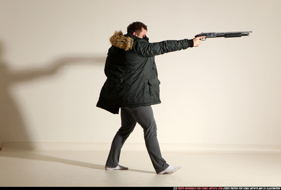 Man Adult Muscular White Fighting with gun Standing poses Casual