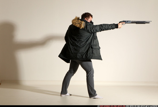 Man Adult Muscular White Fighting with gun Standing poses Casual