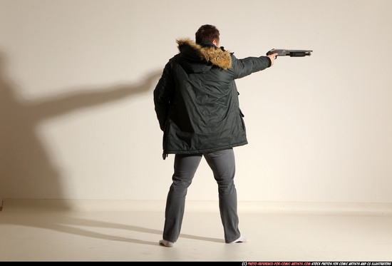 Man Adult Muscular White Fighting with gun Standing poses Casual