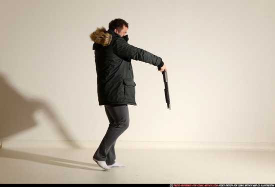 Man Adult Muscular White Fighting with gun Standing poses Casual