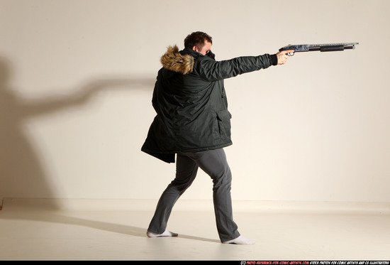 Man Adult Muscular White Fighting with gun Standing poses Casual