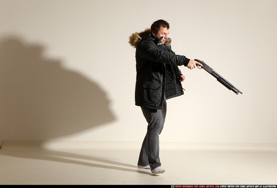 Man Adult Muscular White Fighting with gun Standing poses Casual