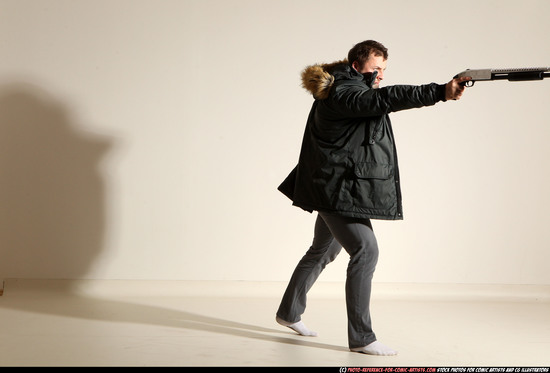 Man Adult Muscular White Fighting with gun Standing poses Casual