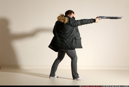 Man Adult Muscular White Fighting with gun Standing poses Casual