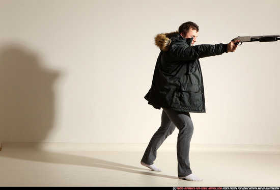 Man Adult Muscular White Fighting with gun Standing poses Casual