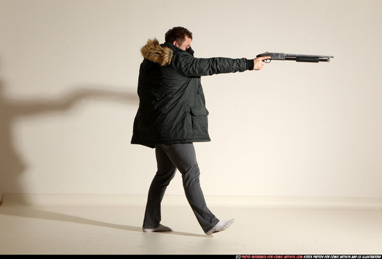 Man Adult Muscular White Fighting with gun Standing poses Casual