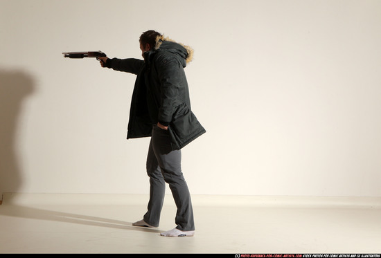 Man Adult Muscular White Fighting with gun Standing poses Casual