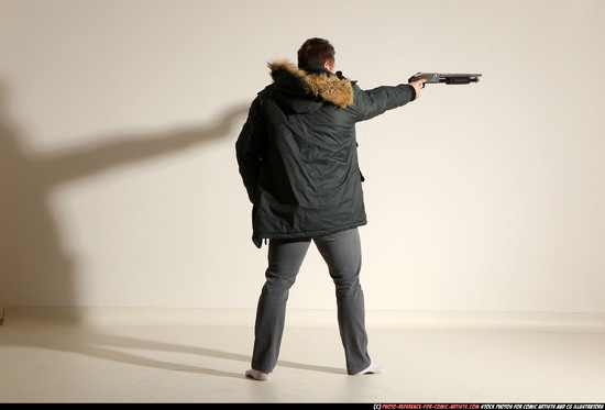 Man Adult Muscular White Fighting with gun Standing poses Casual