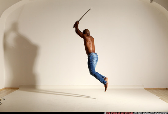 Man Adult Athletic Black Fighting with sword Moving poses Pants