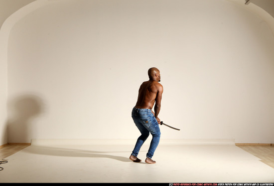 Man Adult Athletic Black Fighting with sword Moving poses Pants