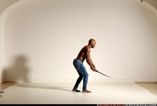 Man Adult Athletic Black Fighting with sword Moving poses Pants