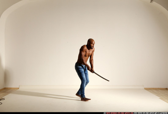 Man Adult Athletic Black Fighting with sword Moving poses Pants