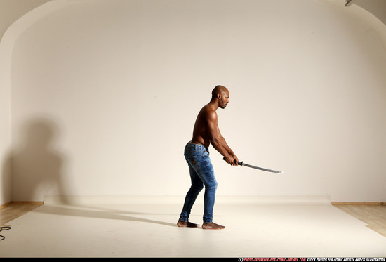 Man Adult Athletic Black Fighting with sword Moving poses Pants