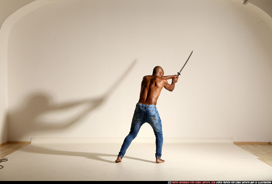 Man Adult Athletic Black Fighting with sword Moving poses Pants