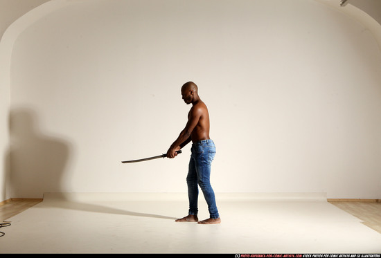 Man Adult Athletic Black Fighting with sword Moving poses Pants