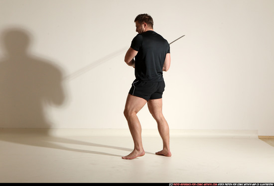 Man Adult Muscular White Fighting with sword Kneeling poses Sportswear