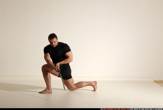 Man Adult Muscular White Fighting with sword Kneeling poses Sportswear