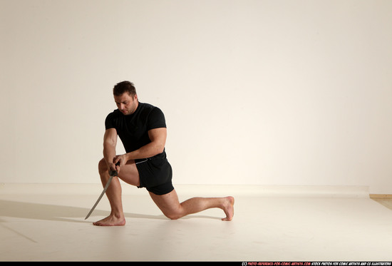 Man Adult Muscular White Fighting with sword Kneeling poses Sportswear