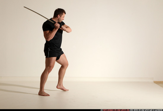 Man Adult Muscular White Fighting with sword Kneeling poses Sportswear