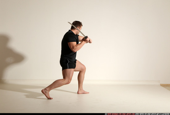 Man Adult Muscular White Fighting with sword Kneeling poses Sportswear