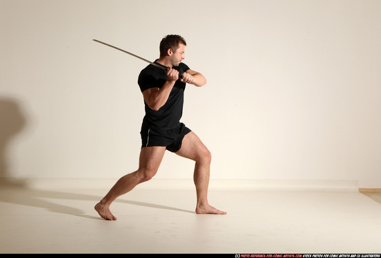 Man Adult Muscular White Fighting with sword Kneeling poses Sportswear