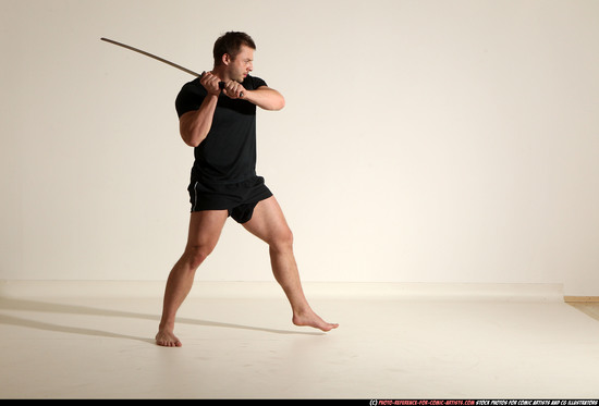 Man Adult Muscular White Fighting with sword Kneeling poses Sportswear