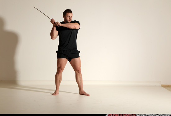 Man Adult Muscular White Fighting with sword Kneeling poses Sportswear