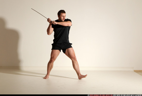 Man Adult Muscular White Fighting with sword Kneeling poses Sportswear