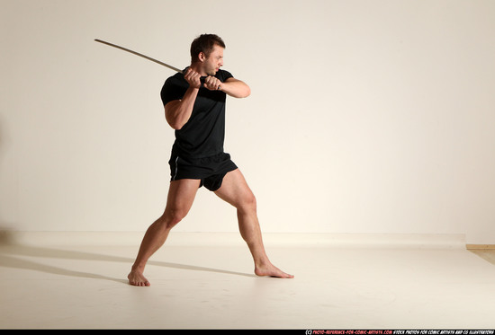 Man Adult Muscular White Fighting with sword Kneeling poses Sportswear