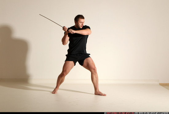 Man Adult Muscular White Fighting with sword Kneeling poses Sportswear