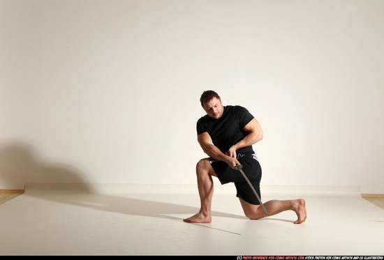 Man Adult Muscular White Fighting with sword Kneeling poses Sportswear