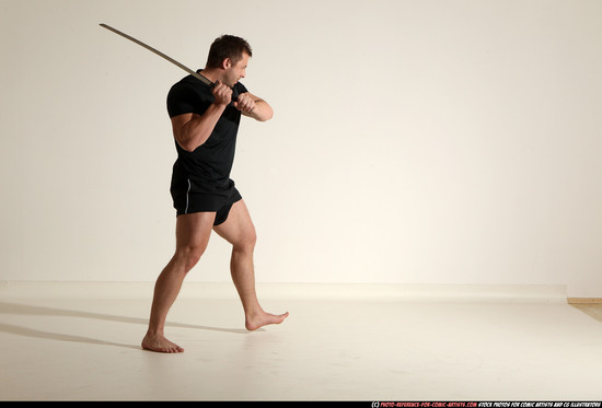 Man Adult Muscular White Fighting with sword Kneeling poses Sportswear