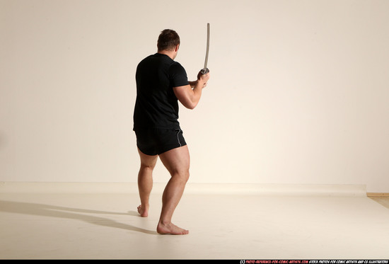 Man Adult Muscular White Fighting with sword Kneeling poses Sportswear