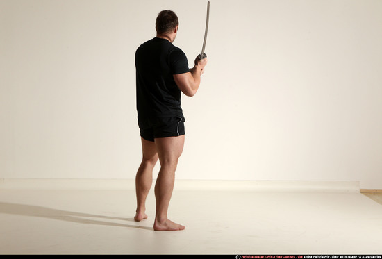 Man Adult Muscular White Fighting with sword Kneeling poses Sportswear