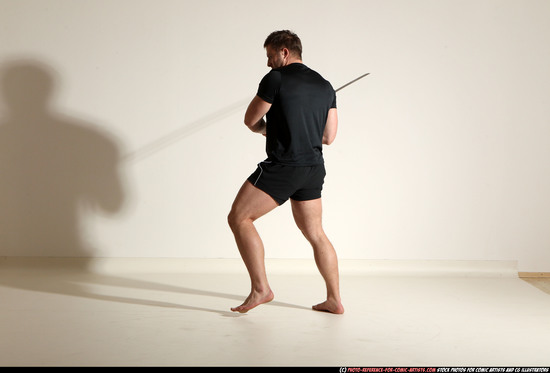 Man Adult Muscular White Fighting with sword Kneeling poses Sportswear