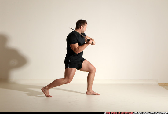 Man Adult Muscular White Fighting with sword Kneeling poses Sportswear