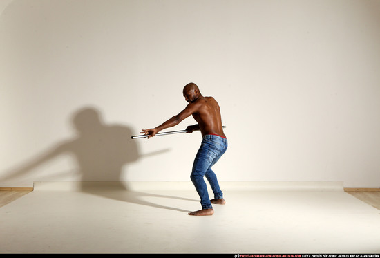 Man Adult Athletic Black Fighting with spear Moving poses Pants