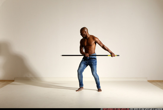 Man Adult Athletic Black Fighting with spear Moving poses Pants