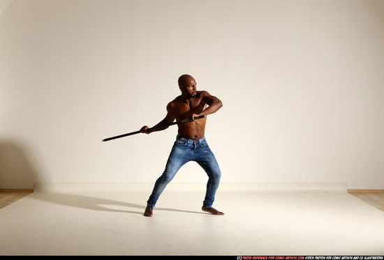 Man Adult Athletic Black Fighting with spear Moving poses Pants