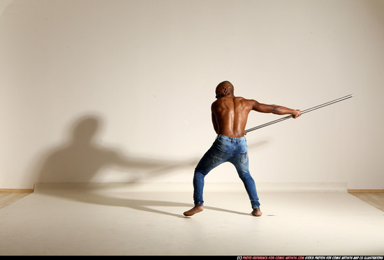 Man Adult Athletic Black Fighting with spear Moving poses Pants