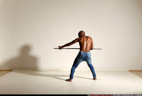 Man Adult Athletic Black Fighting with spear Moving poses Pants