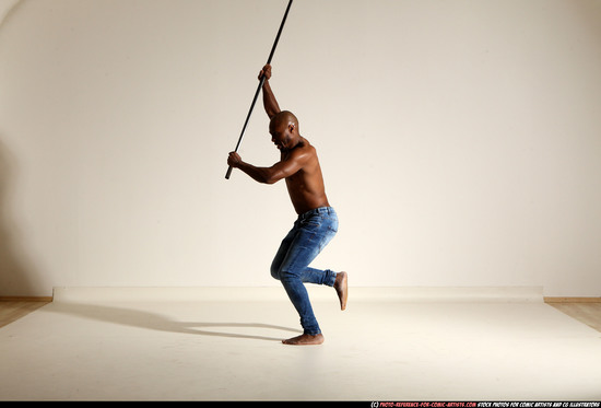 Man Adult Athletic Black Fighting with spear Moving poses Pants