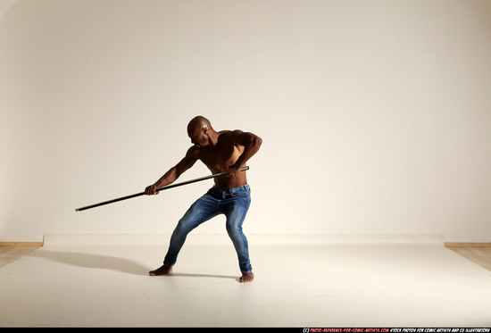 Man Adult Athletic Black Fighting with spear Moving poses Pants