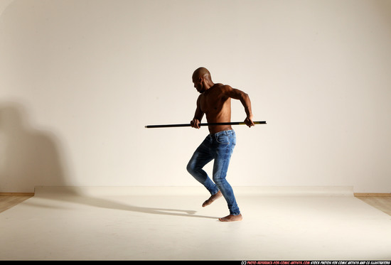 Man Adult Athletic Black Fighting with spear Moving poses Pants