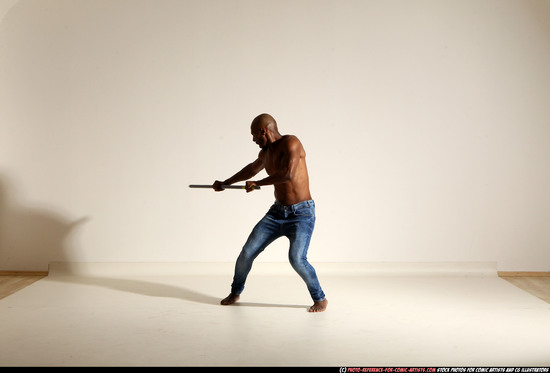 Man Adult Athletic Black Fighting with spear Moving poses Pants